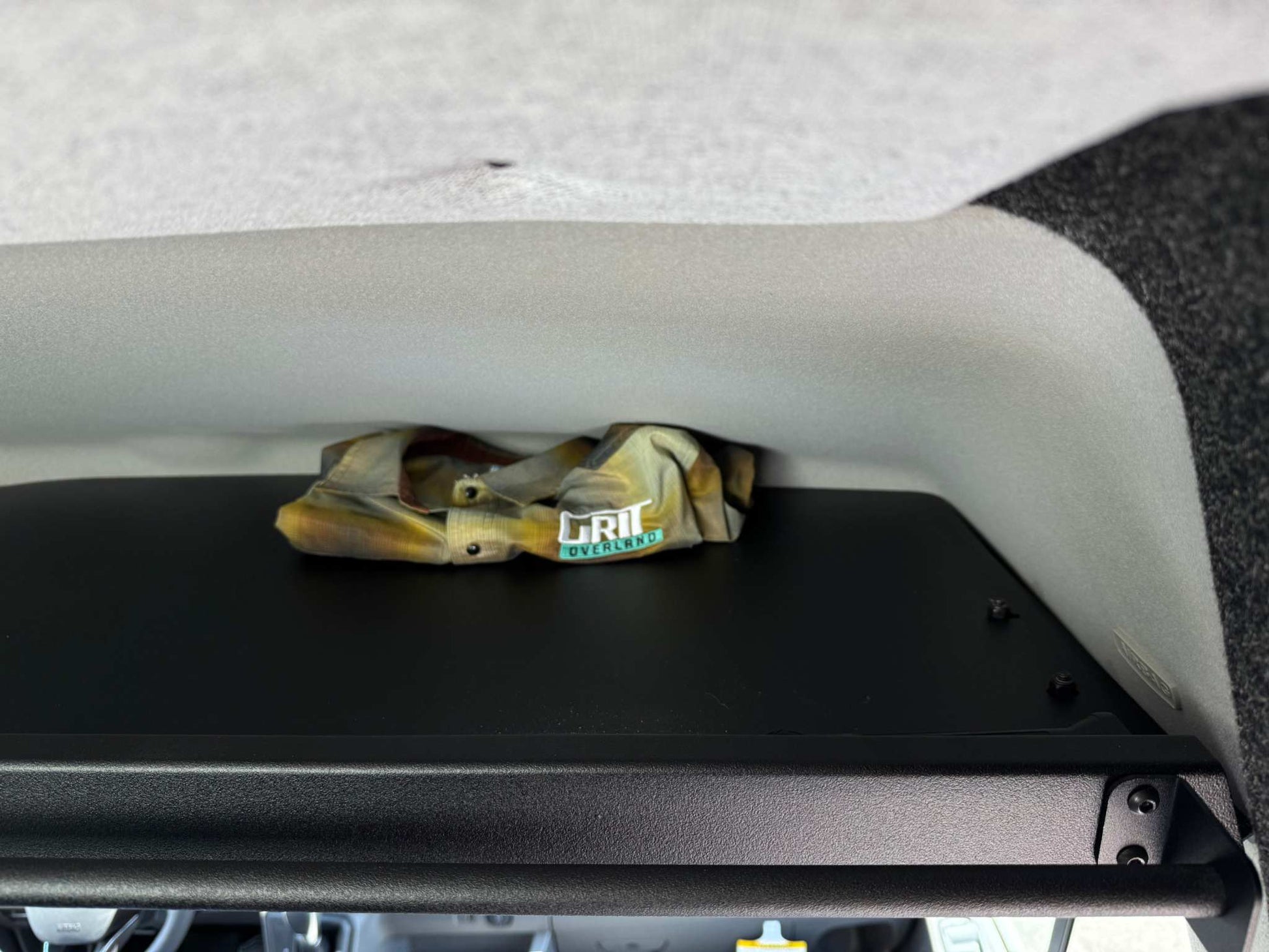 Transit Headliner Shelf with curtain rod installed inside vehicle for durable storage and organization