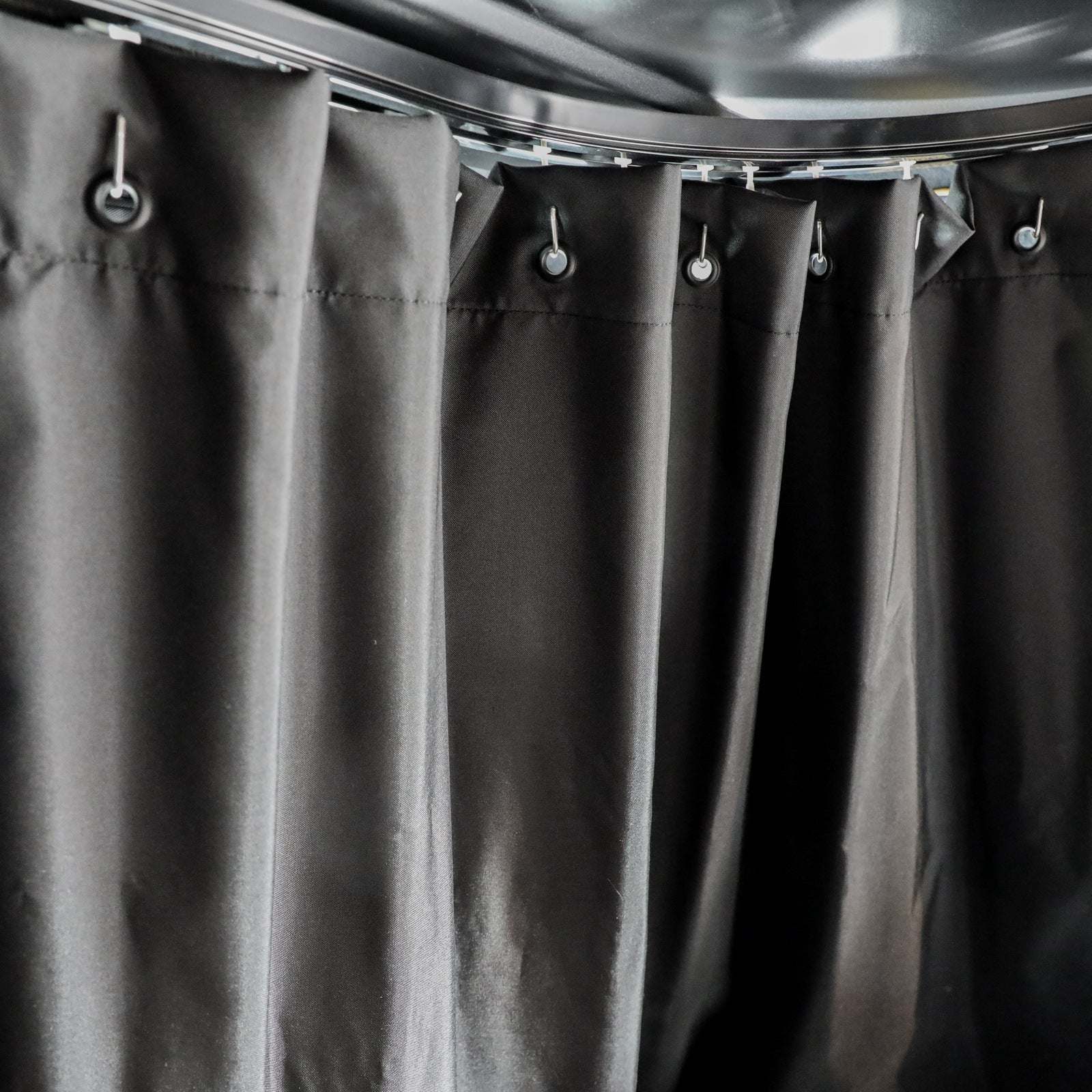 Black dual-layer insulated Sprinter curtain with magnetic tabs for cab and living space separation