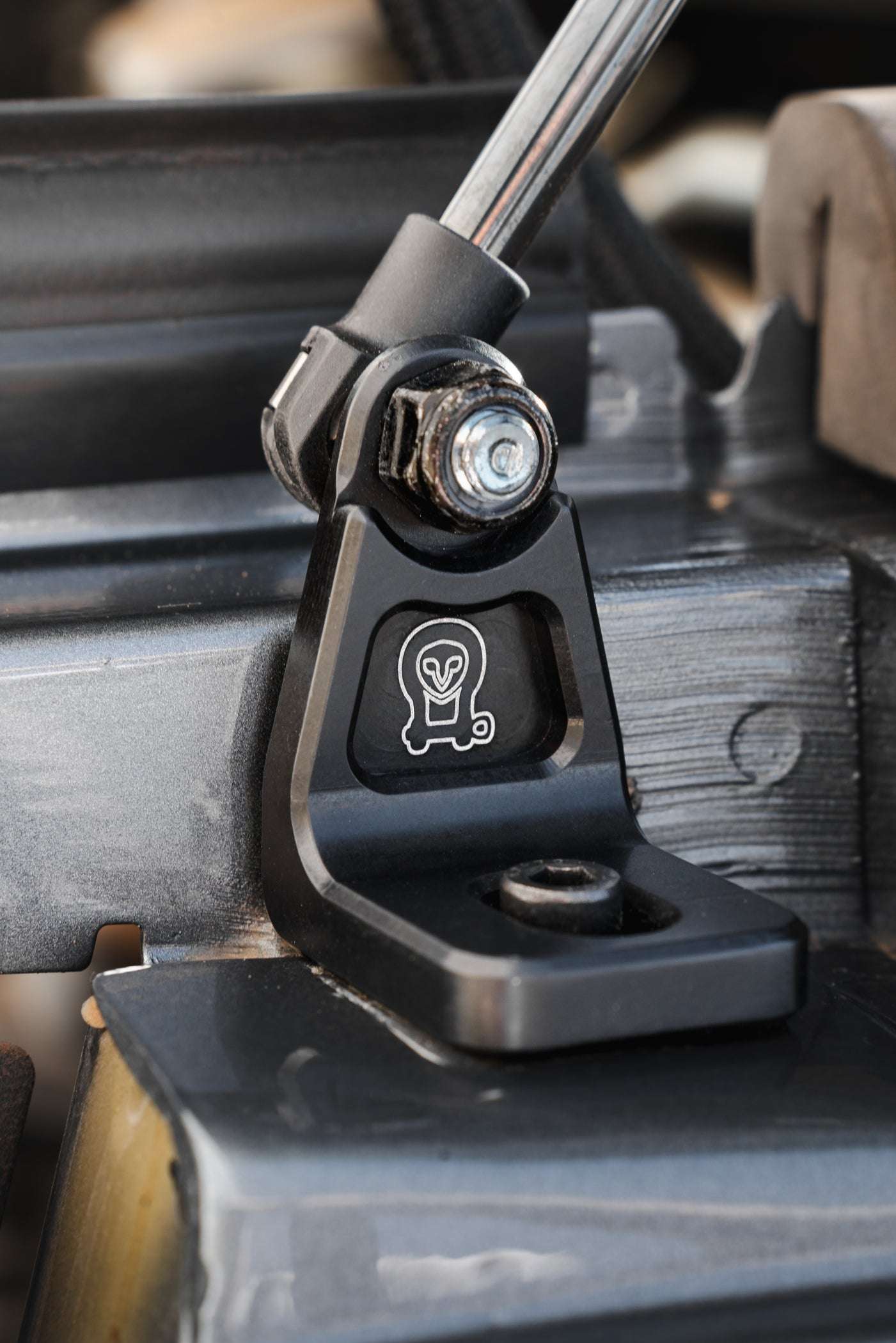 Close-up of Sprinter Hood Strut Kit with black anodized billet aluminum mount and gas strut mechanism