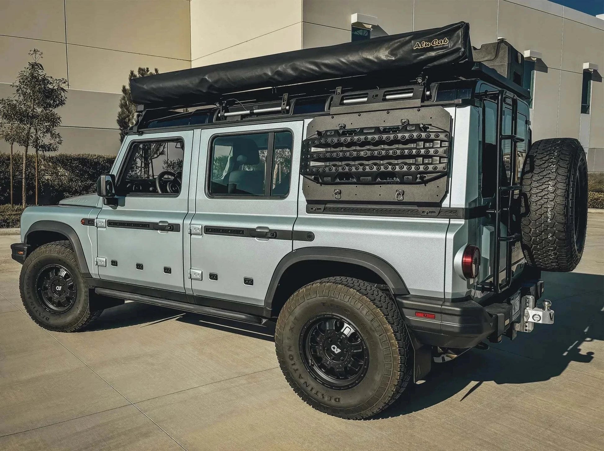 INEOS Grenadier with mounted Leitner Designs Side Kick Grenadier Accessory Panel on rear side for off-road adventure utility