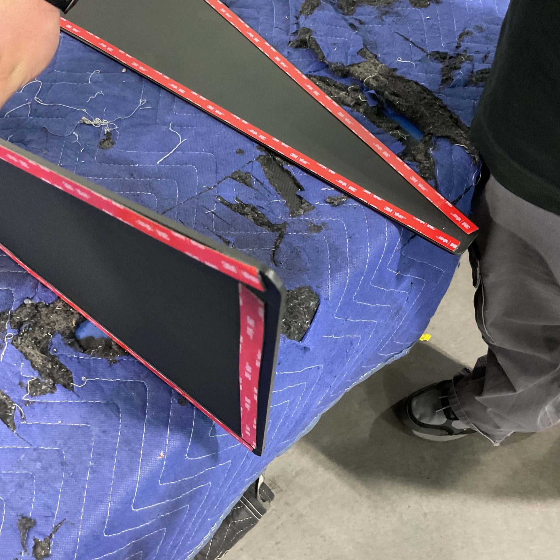 INEOS Grenadier Fender Armor Plates laid out on protective blue blanket showing adhesive backing.