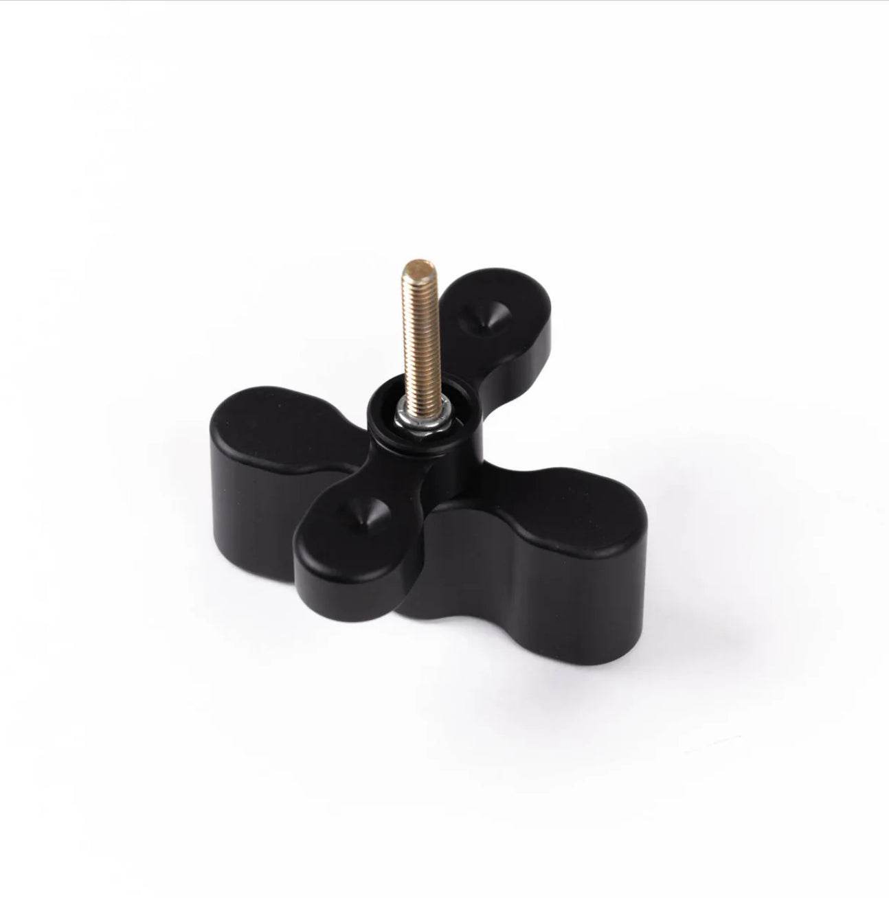 Black anodized aluminum Pax Mount Extension with central threaded bolt for stacking packs