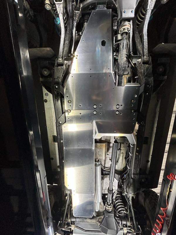 Grenadier skid plate protecting vehicle undercarriage for offroad drivetrain safety