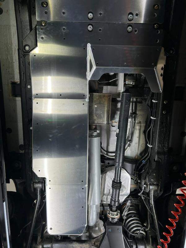Grenadier skid plate system protecting drivetrain with high-strength metal undercarriage shield