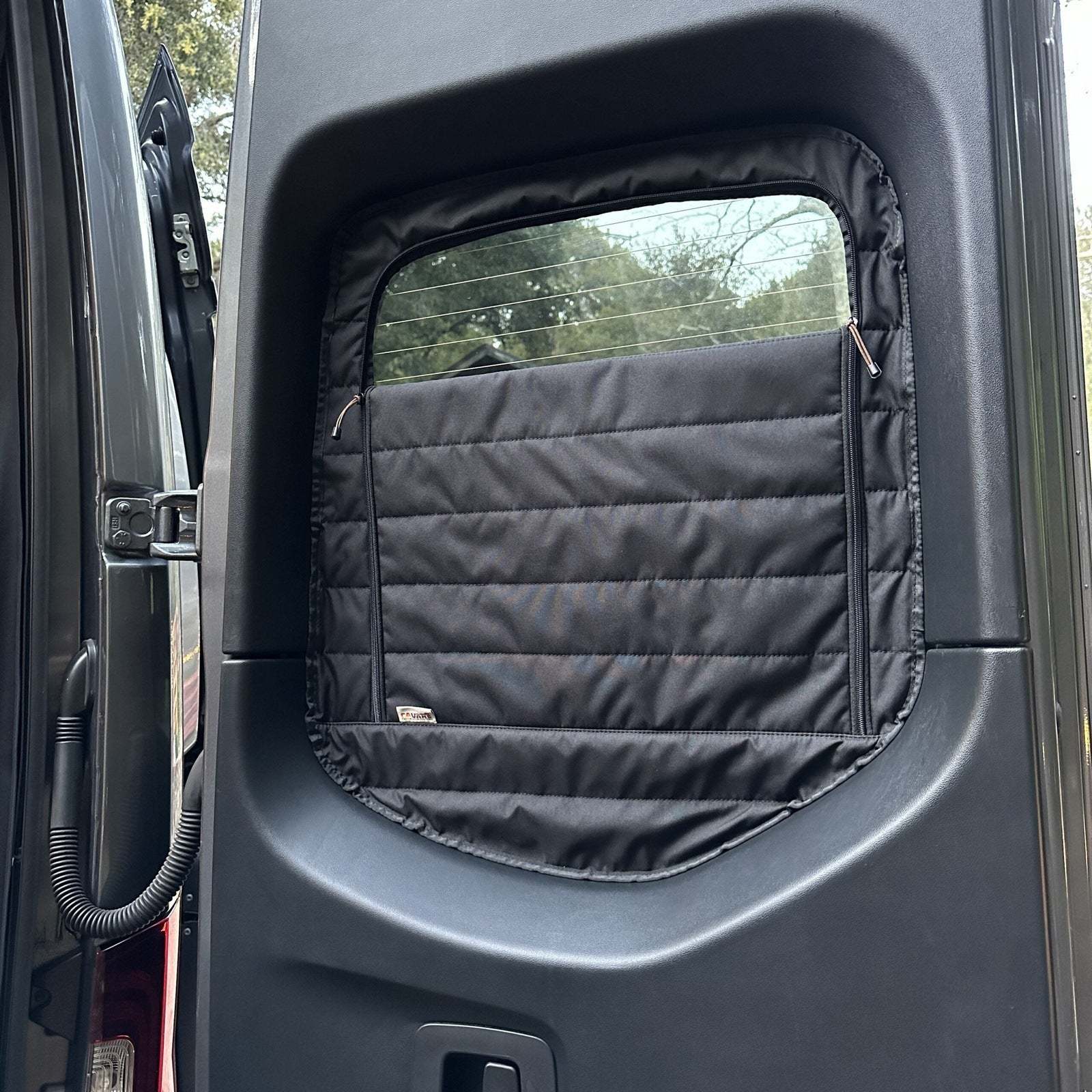 Insulated CLIMA-SHADE Sprinter rear window cover with zippered access for temperature control and privacy