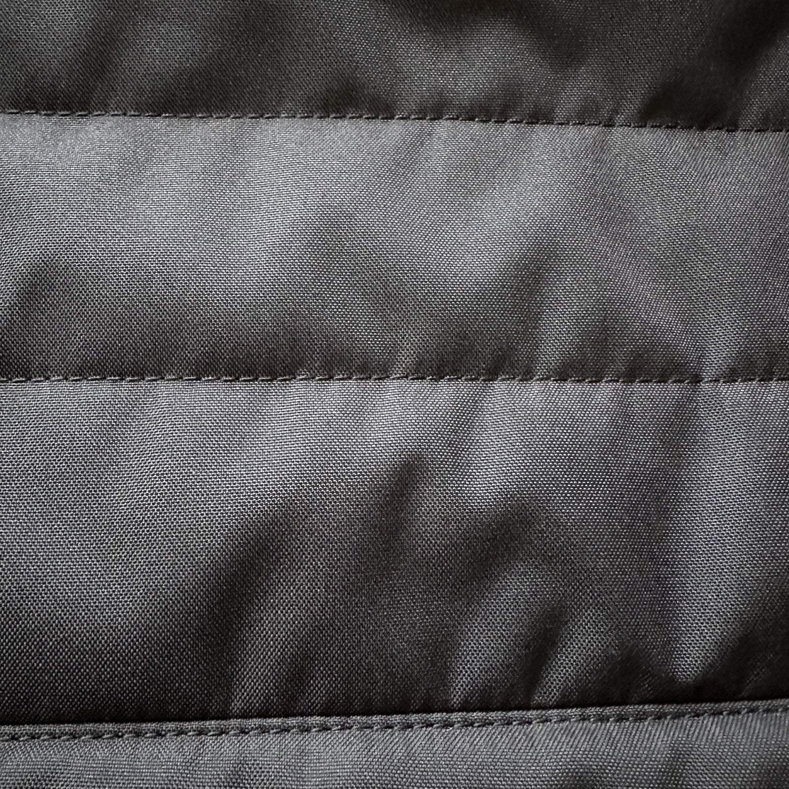 Close-up of black CLIMA-SHADE insulated Sprinter rear window cover showing quilted fabric and durable stitching