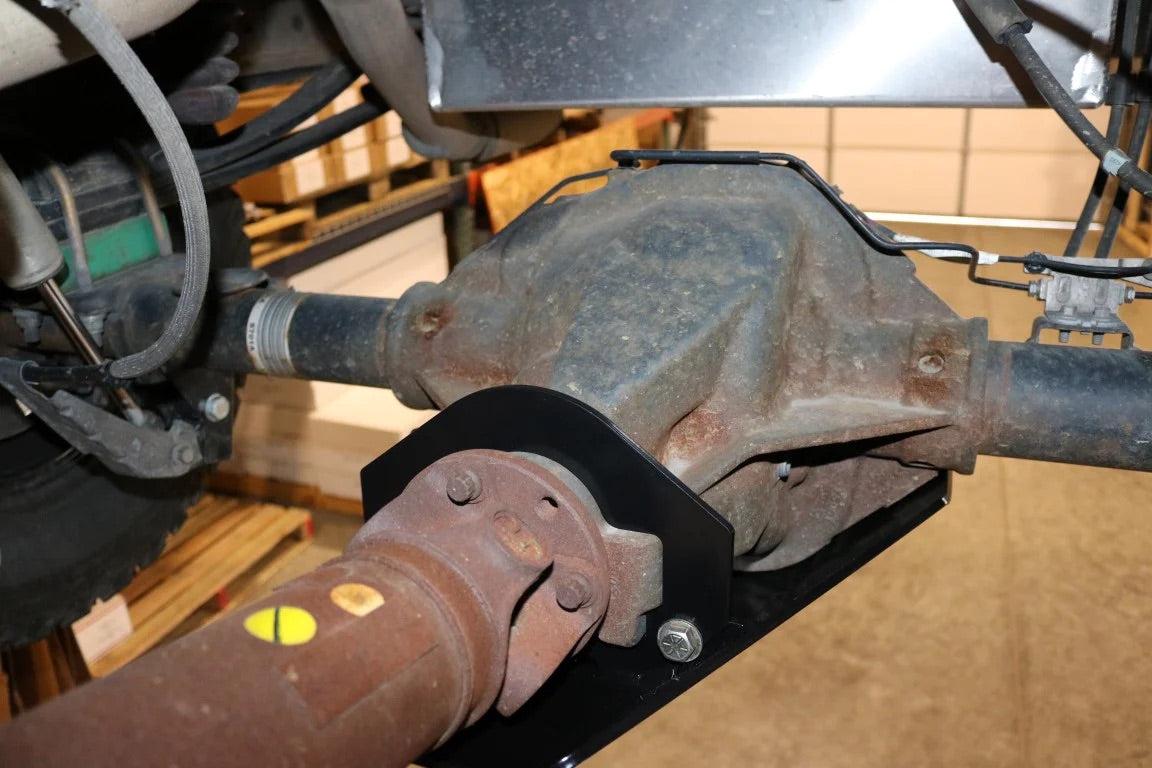 Differential skid plate installed on Transit rear axle protecting differential from damage
