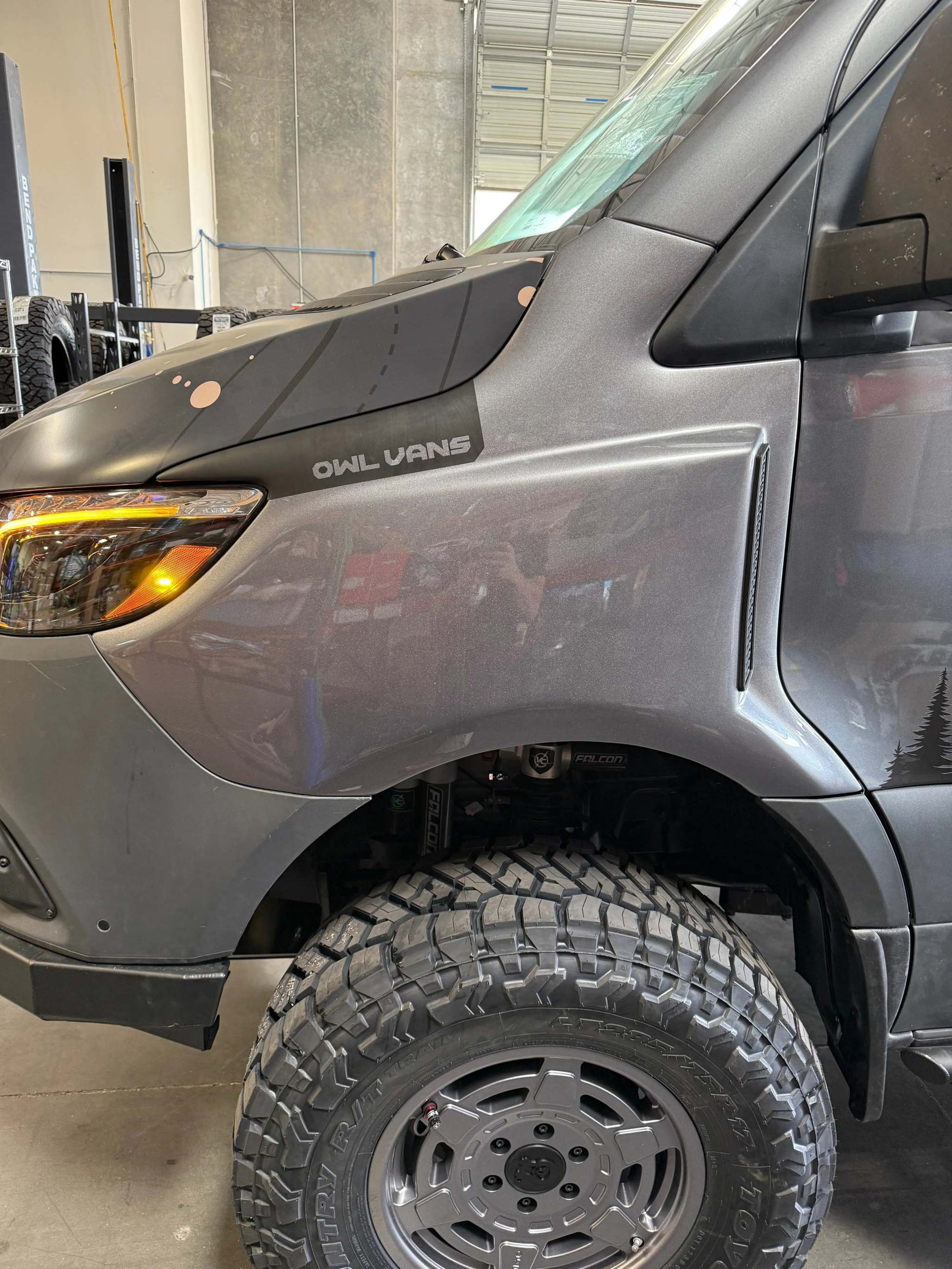 Sprinter van front wheel with rugged Sprinter Trail Fender Flares and off-road tire