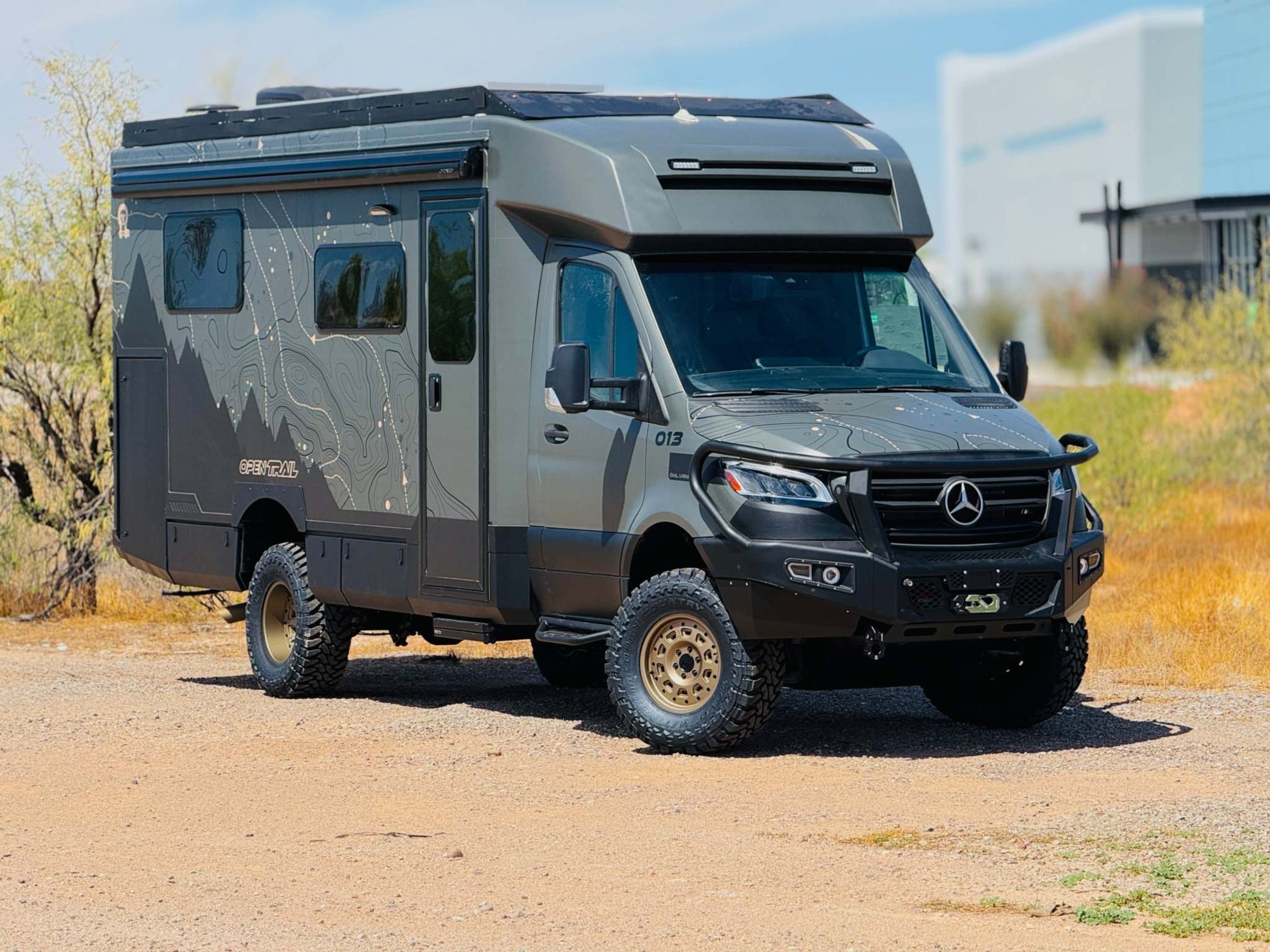 OTX Tiffin Open Trail adventure van with rugged tires and custom exterior design parked outdoors