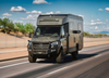OTX Tiffin Open Trail adventure van on road with rugged design and Mercedes front grille