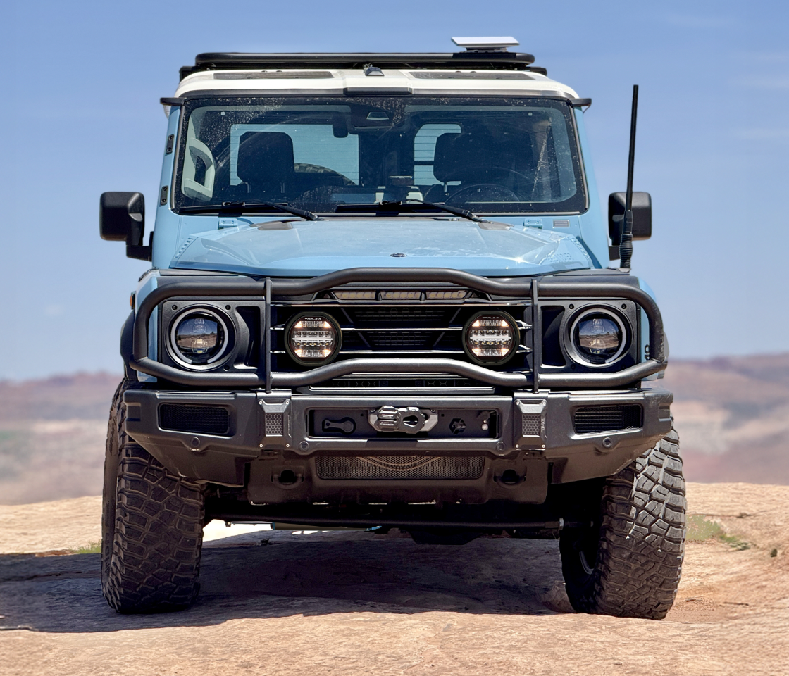 Owl Grenadier Steering Stabilizer installed on off-road Grenadier vehicle front view