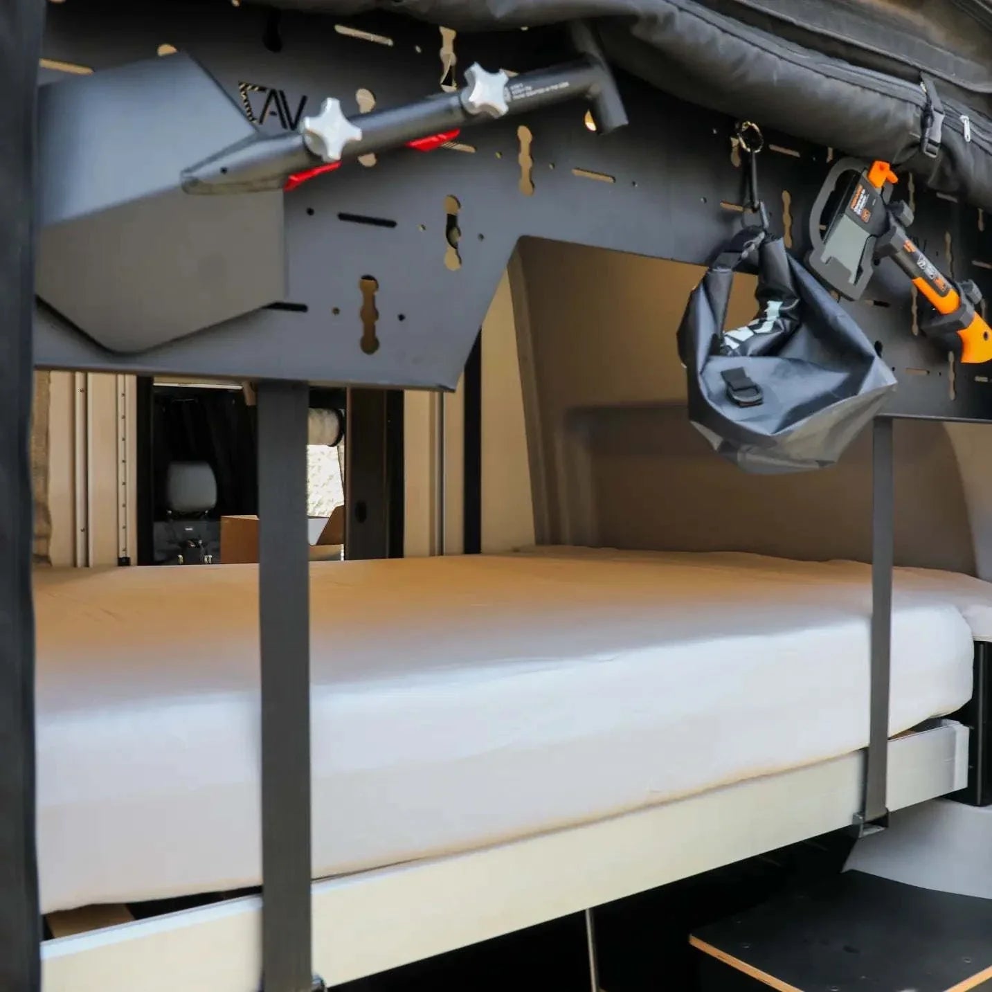 Ultra Luxe Dream Sheets fitted on Winnebago Revel bed system in camper van interior