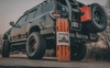 Off-road vehicle with mounted ActionTrax Steel Pin Traction Boards for enhanced grip.