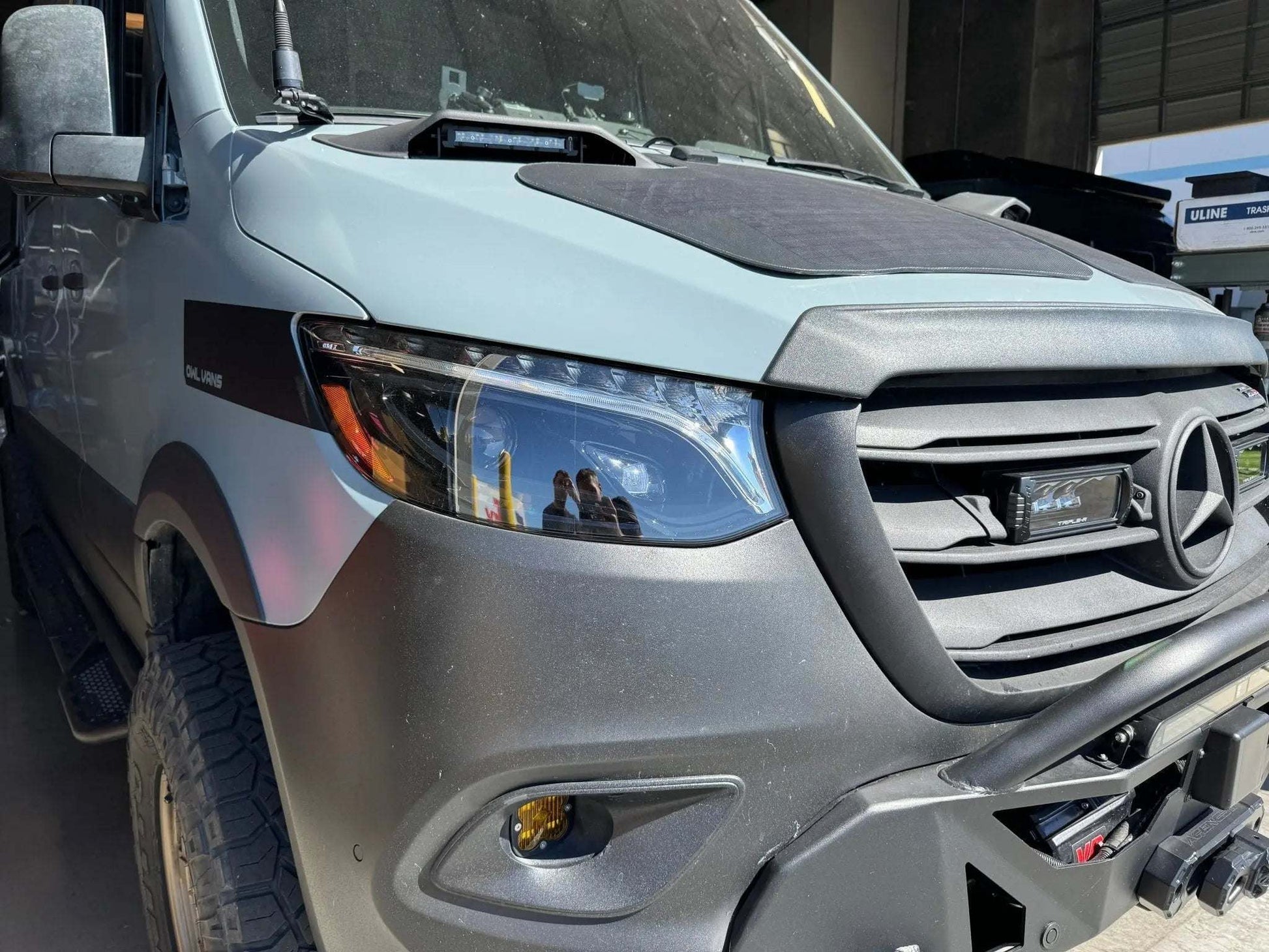 LUXX-Series LED Projector Headlights on 2019+ Sprinter van with modern design.