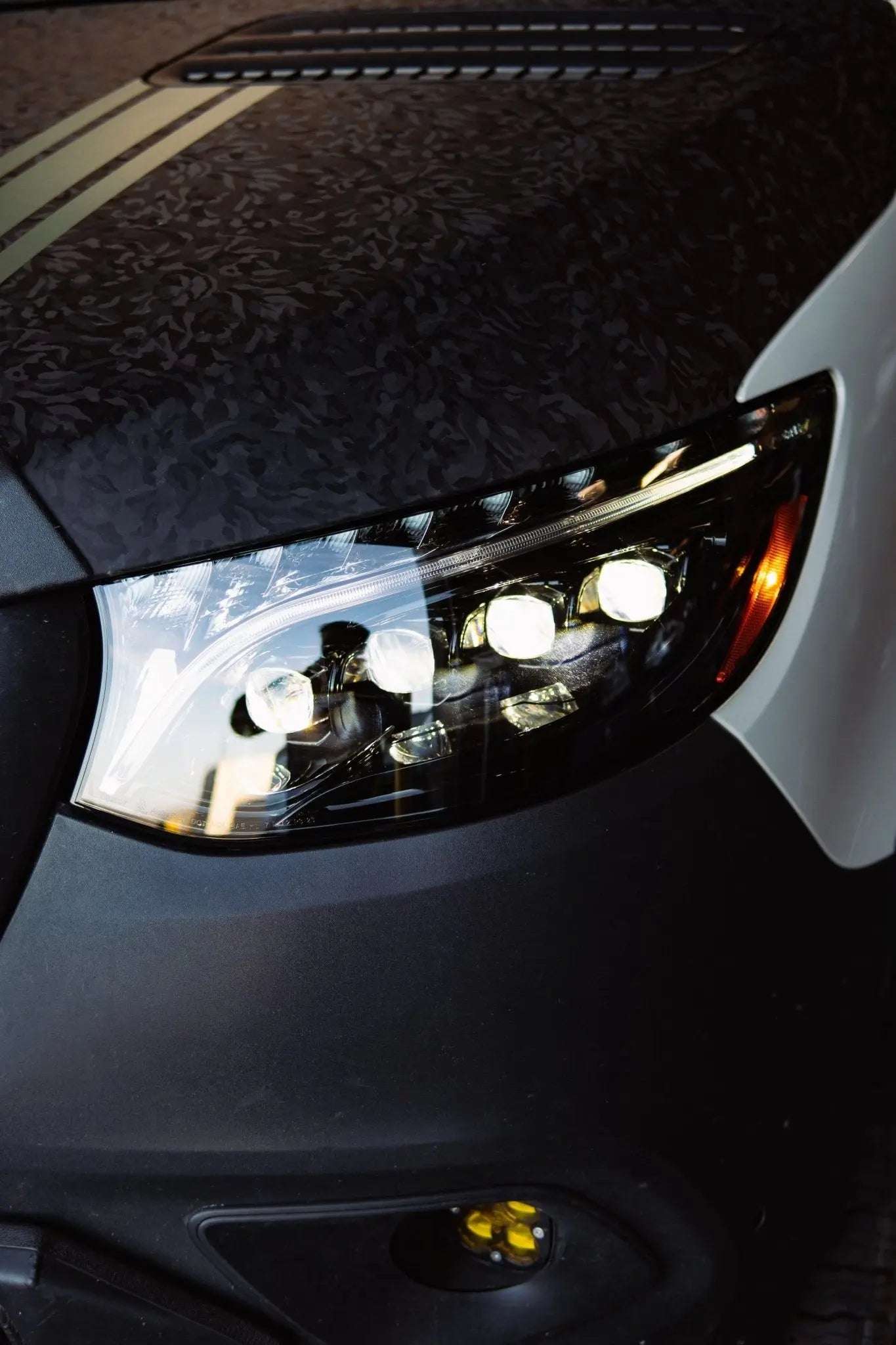 NOVA-Series LED Projector Headlights for Sprinter with sleek blacked-out housing and modern design.