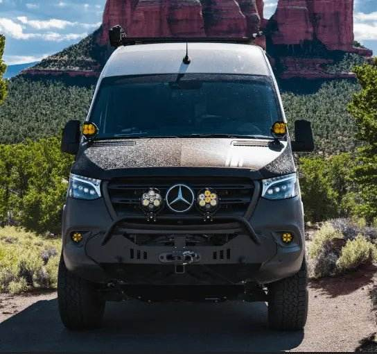 NOVA-Series LED Projector Headlights on a Sprinter van in a scenic outdoor setting.