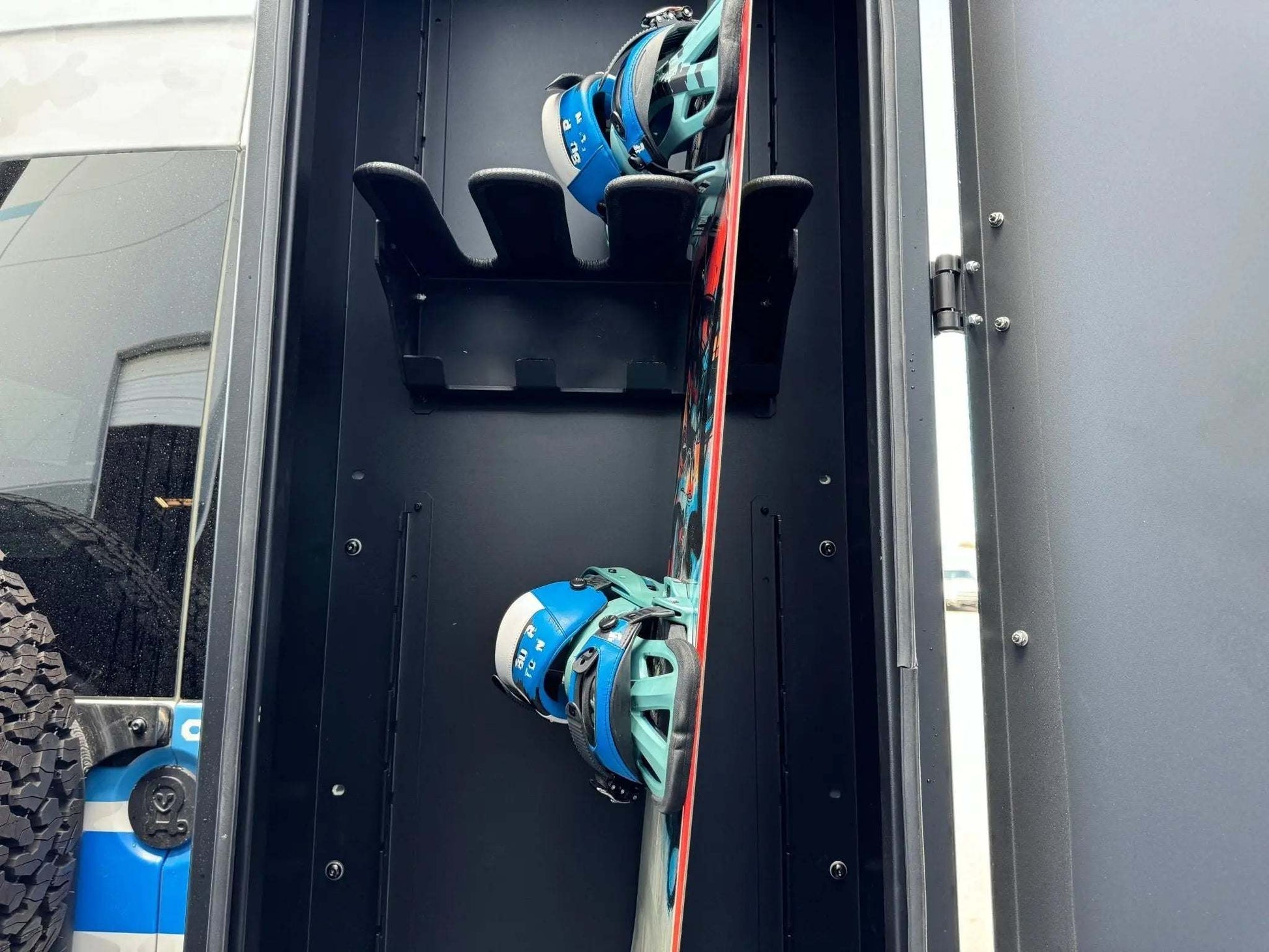 Van storage box Alpine Box with skis and snowboards securely stored inside