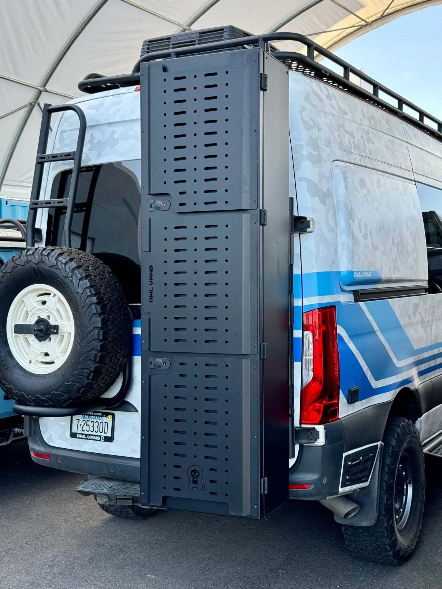 Van storage box mounted on rear of van for ski, snowboard, and golf gear storage