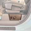 Underseat air compressor system for INEOS Grenadier, mounted under passenger seat for off-road use.