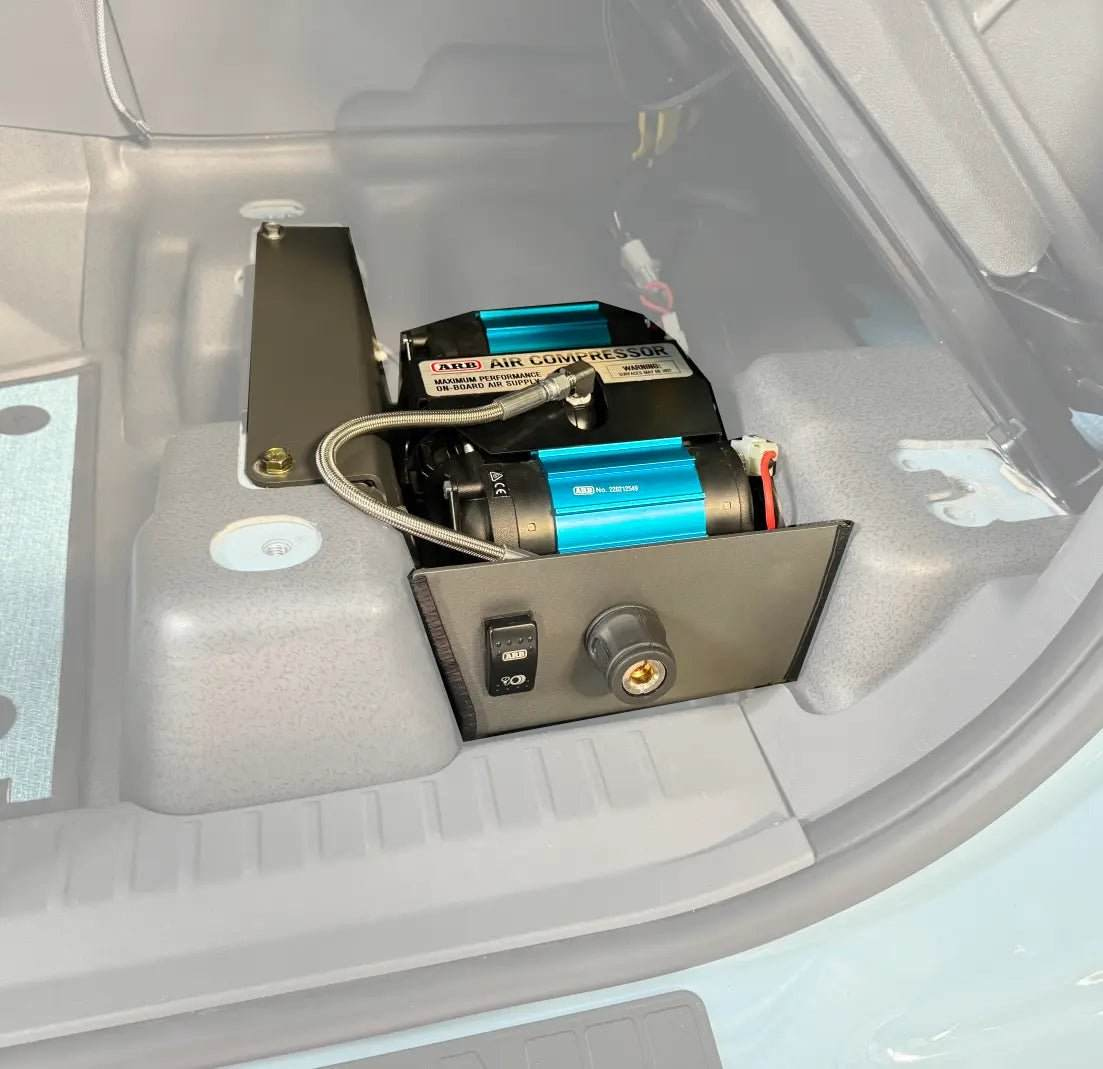 Underseat Air Compressor System for INEOS Grenadier installed under passenger seat.