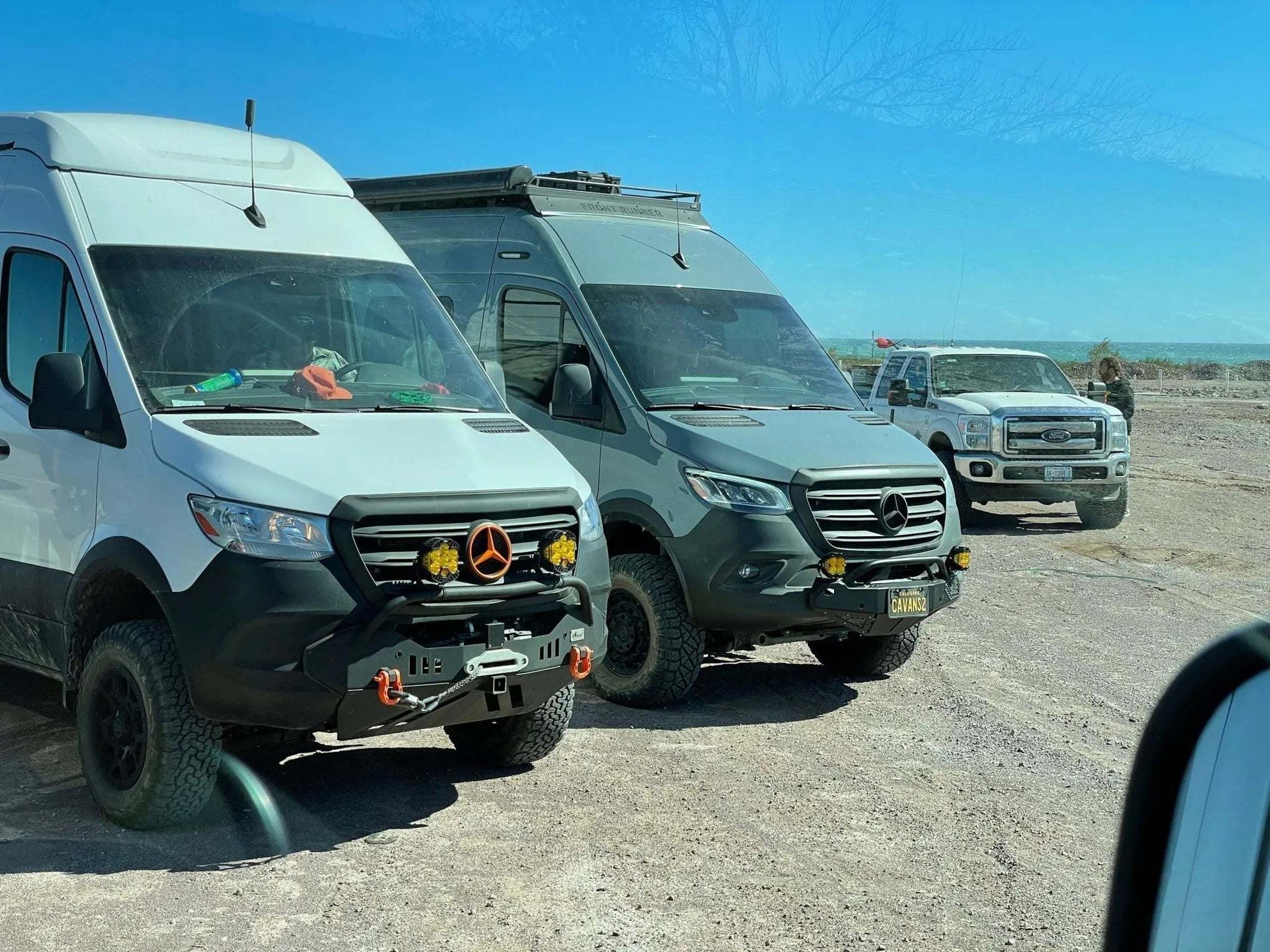 Off-road vehicles equipped with Axia Light Mount brackets and auxiliary lighting.