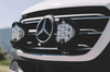 Close-up of LP9 Sport LED Light mounted on vehicle grille with Mercedes emblem