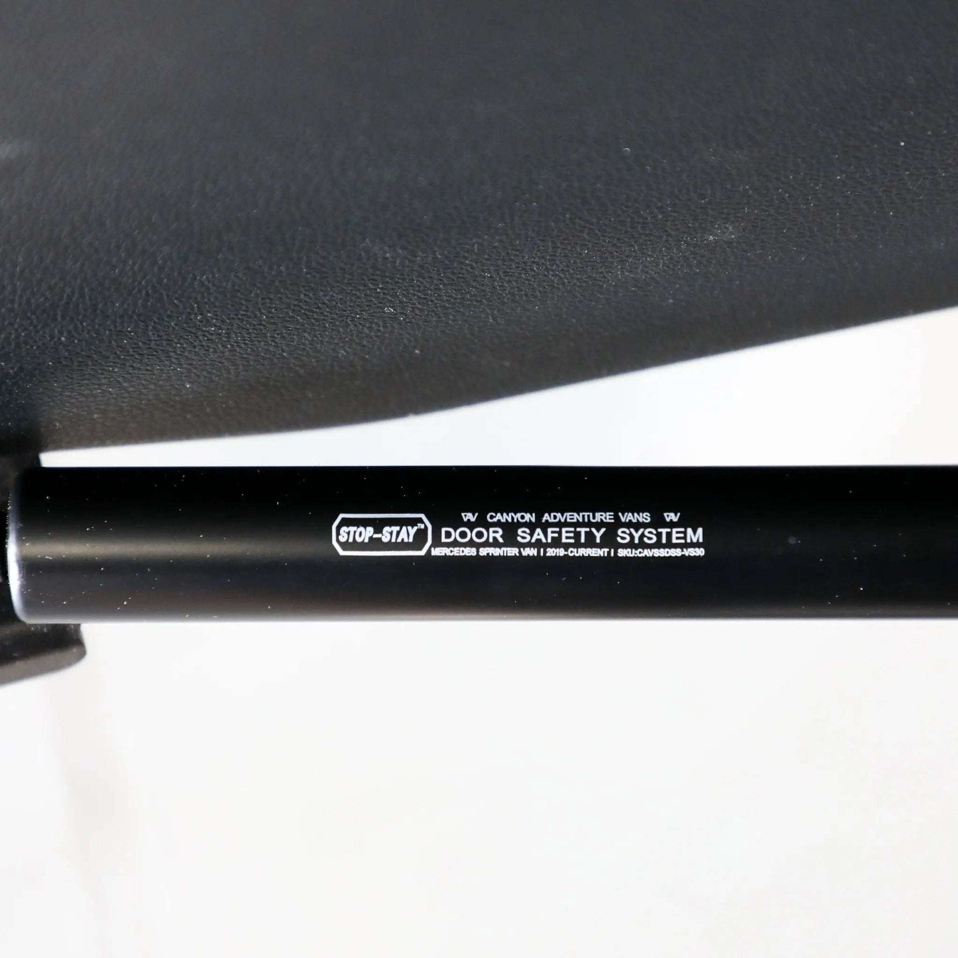 Stop-Stay rear door strut installed on Sprinter van for safety and convenience.