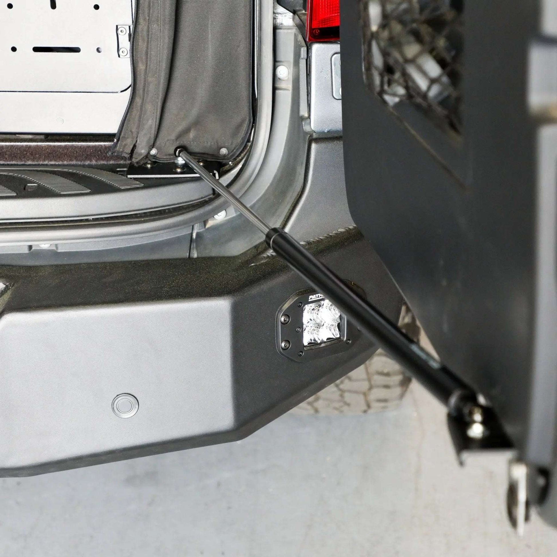 Stop-Stay Rear Door Struts for Sprinter van, preventing door movement.