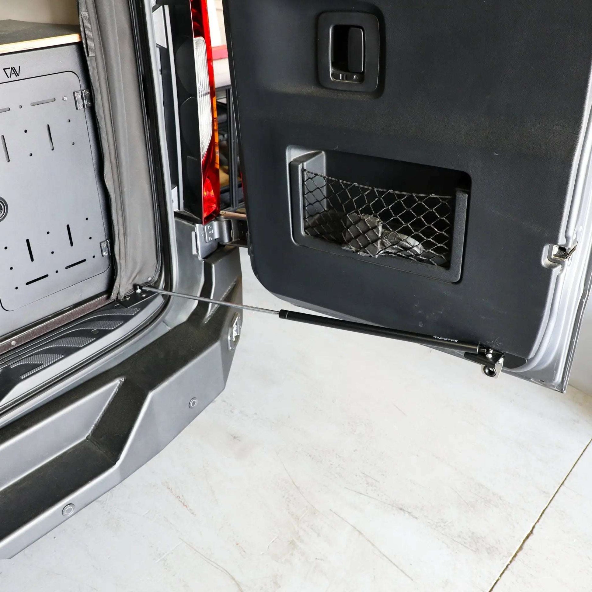 Stop-Stay Rear Door Struts installed on Sprinter van for secure door positioning.
