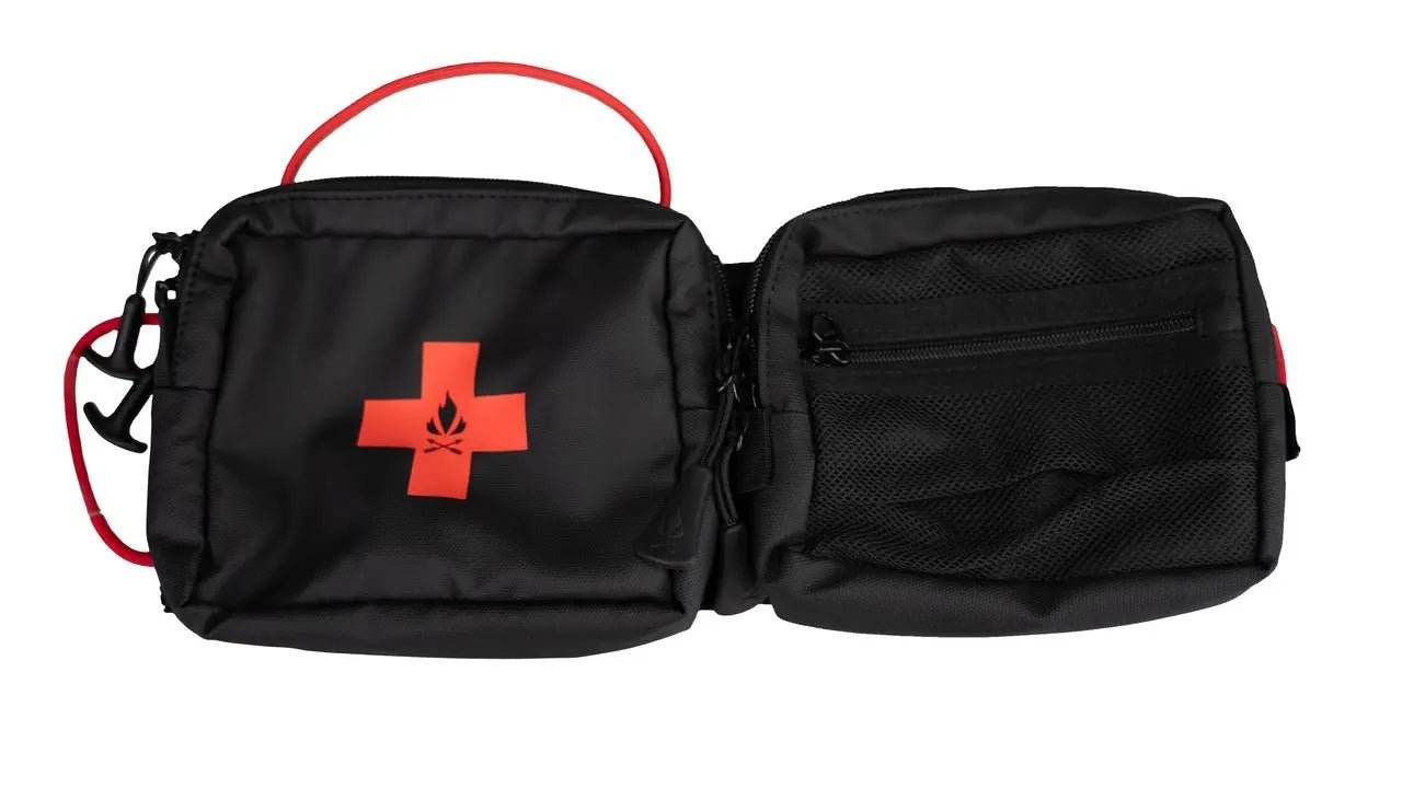Black modular visor panel with tactical webbing for gear storage, featuring zippered pockets and a red handle.