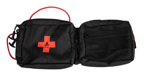 Black modular visor panel with tactical webbing for gear storage, featuring zippered pockets and a red handle.
