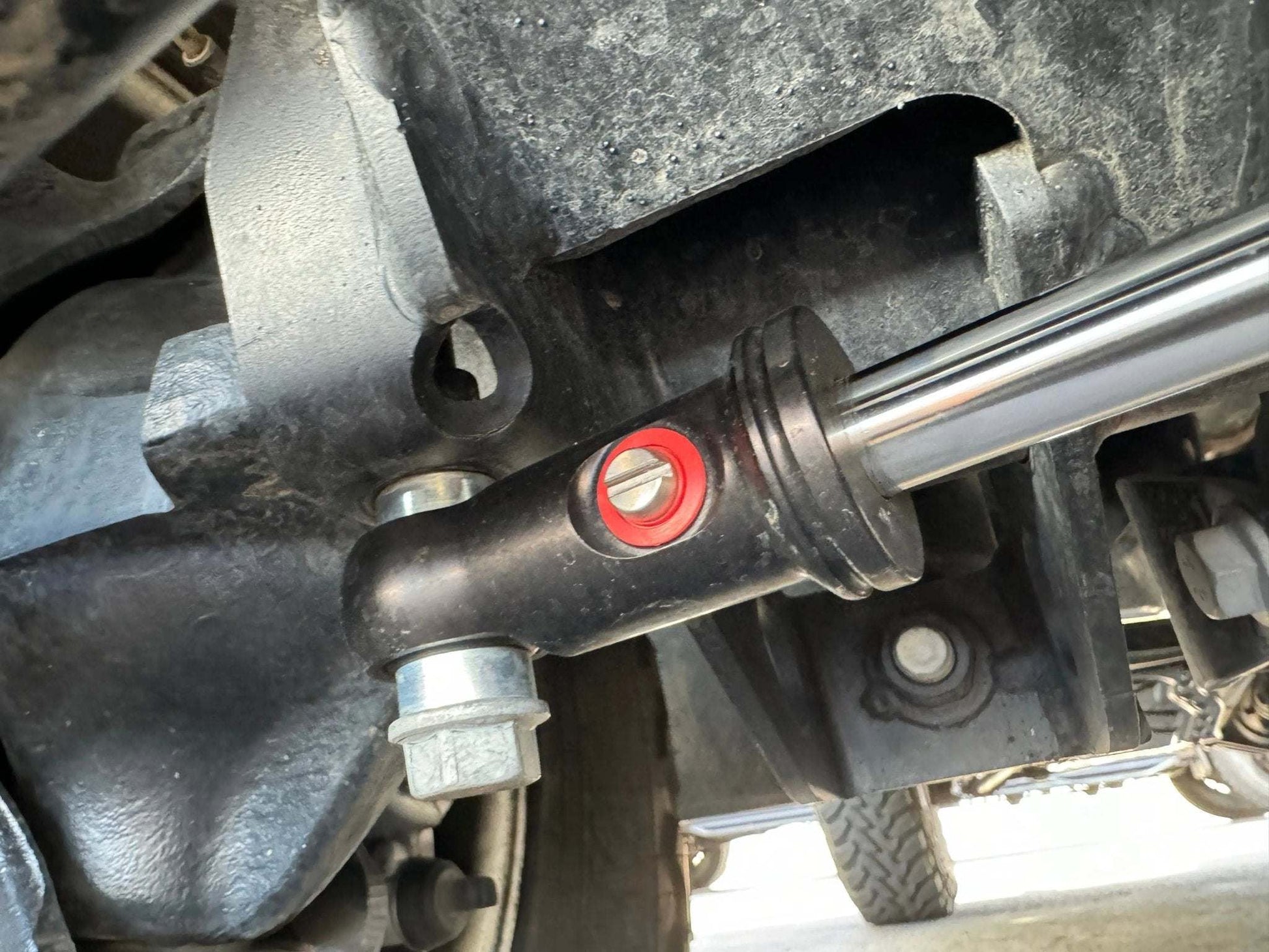 Race Series 2.0 ATS Grenadier Steering Stabilizer on INEOS Grenadier for enhanced off-road performance.