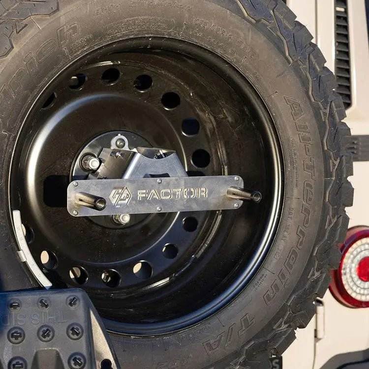Maxtrax Spare Tire Mounting Kit for INEOS Grenadier installed on tire.