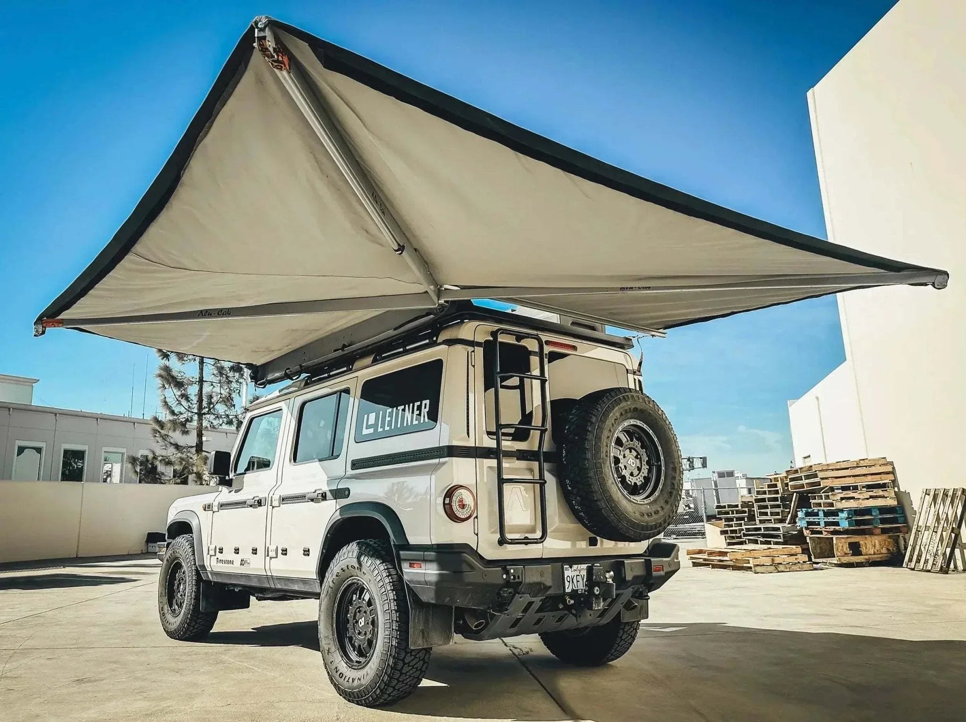 HD Awning Bracket for INEOS Grenadier installed on vehicle showcasing robust awning setup.