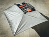 HD Awning Bracket for INEOS Grenadier supporting a robust expedition-grade awning on a roof rack system.
