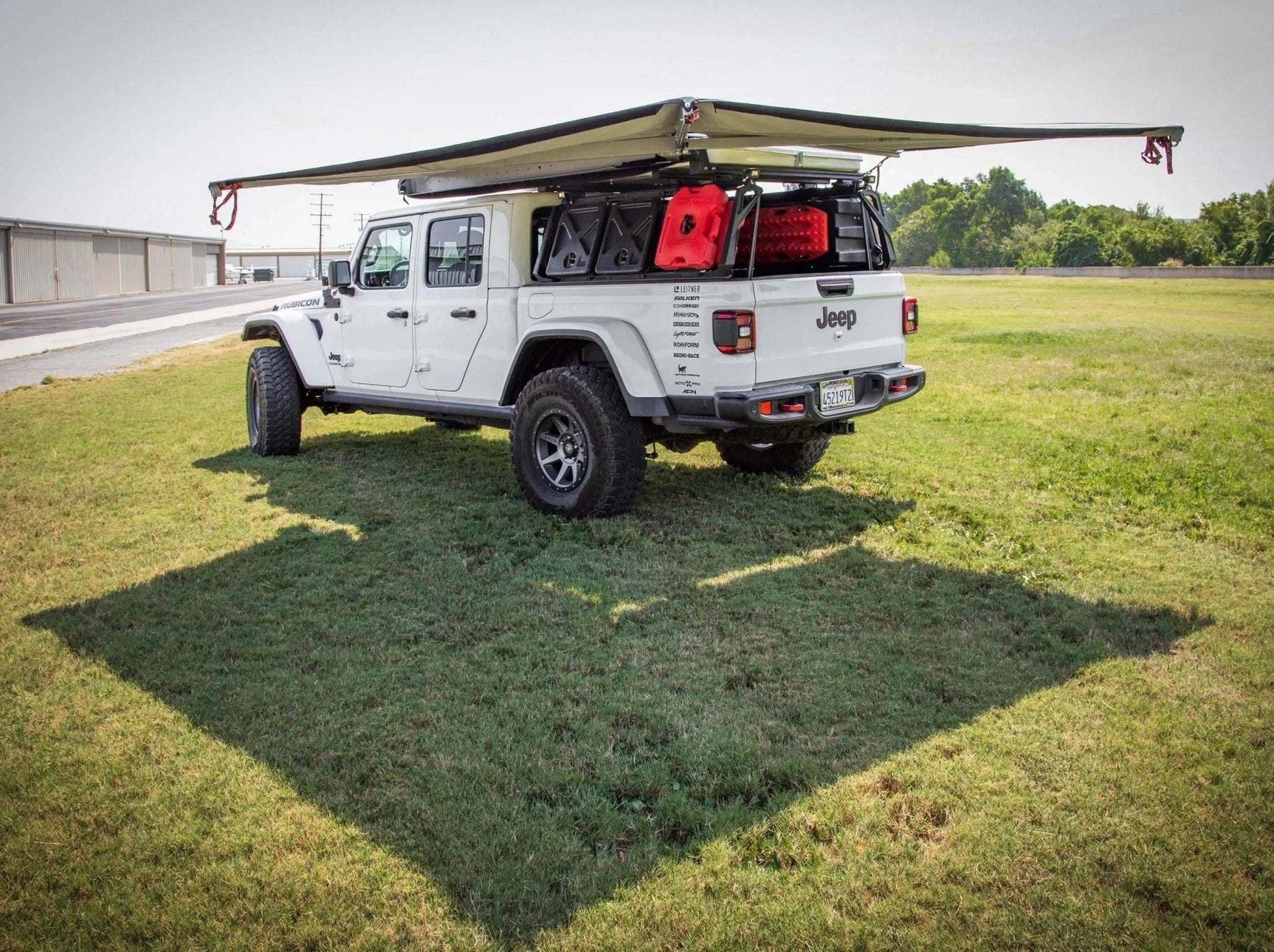 HD Awning Bracket for INEOS Grenadier supporting an awning on a vehicle for durable, trail-ready use.