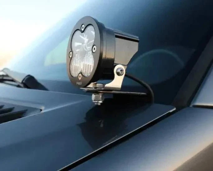 NCV3 Hoodline Light Mount installed on van with LED pod-style light.