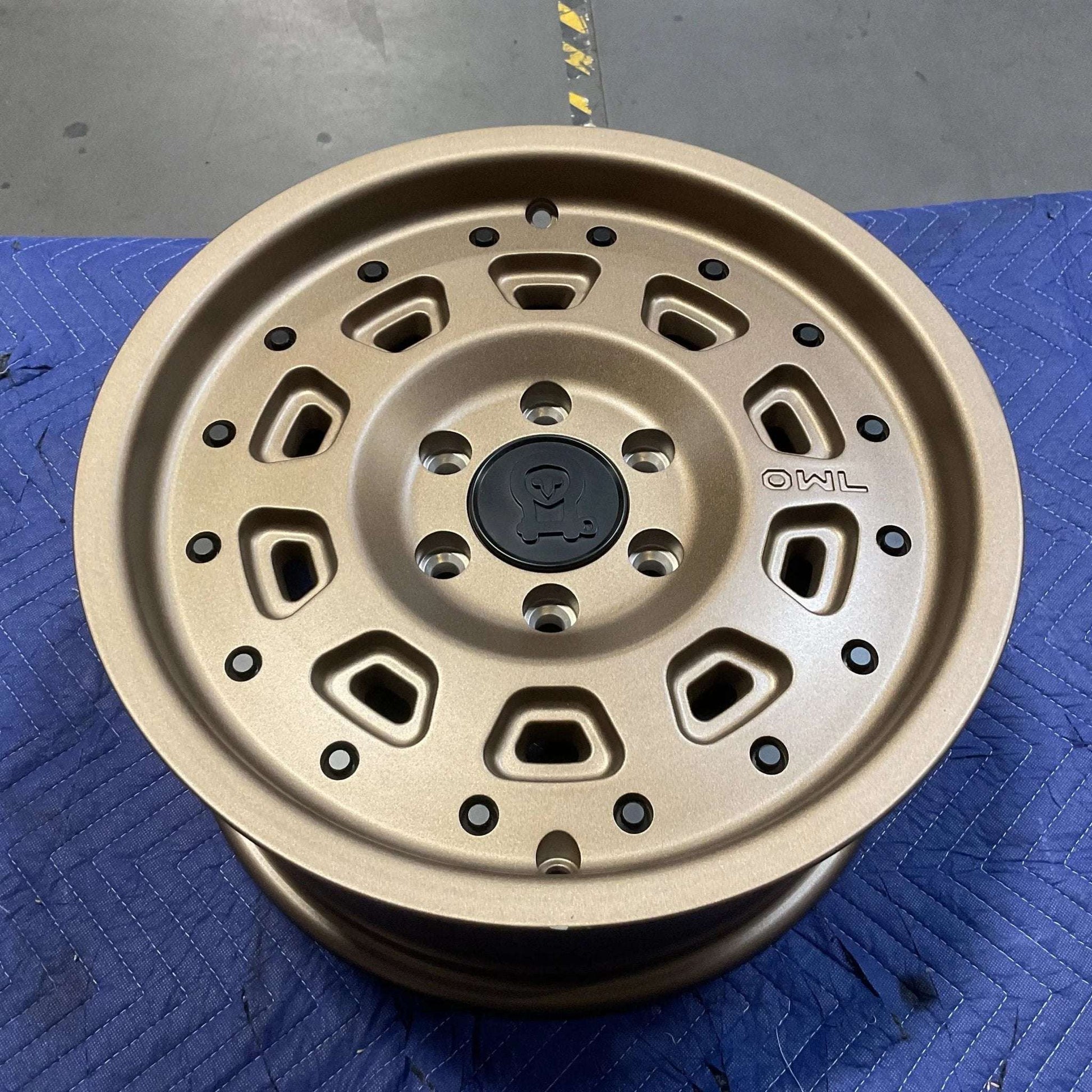 Owl Talon Sprinter wheel in bronze with minor scuffs; high load capacity, durable design.