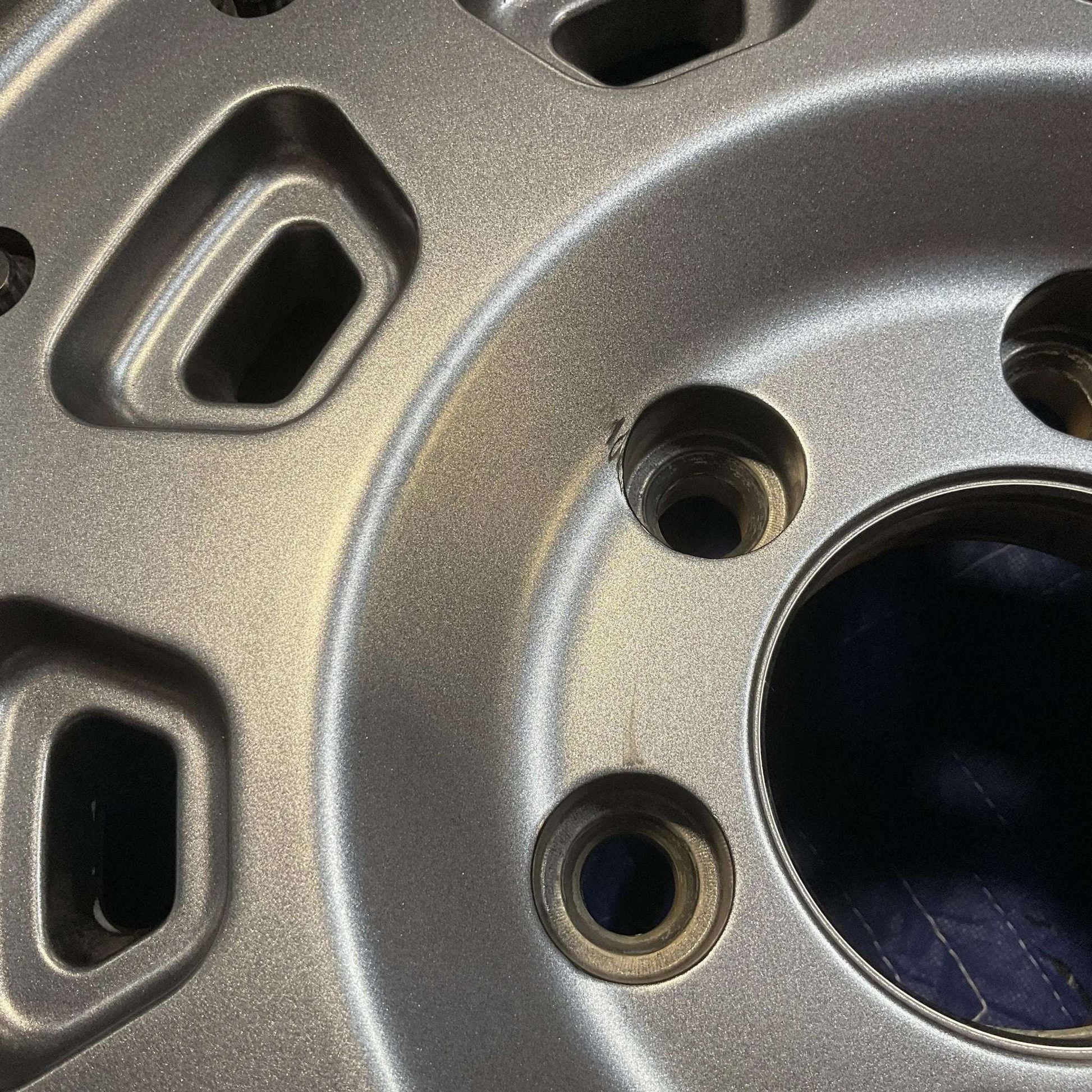 Graphite grey Owl Talon Sprinter wheel with minor scuffs, perfect for heavy-duty vehicles.