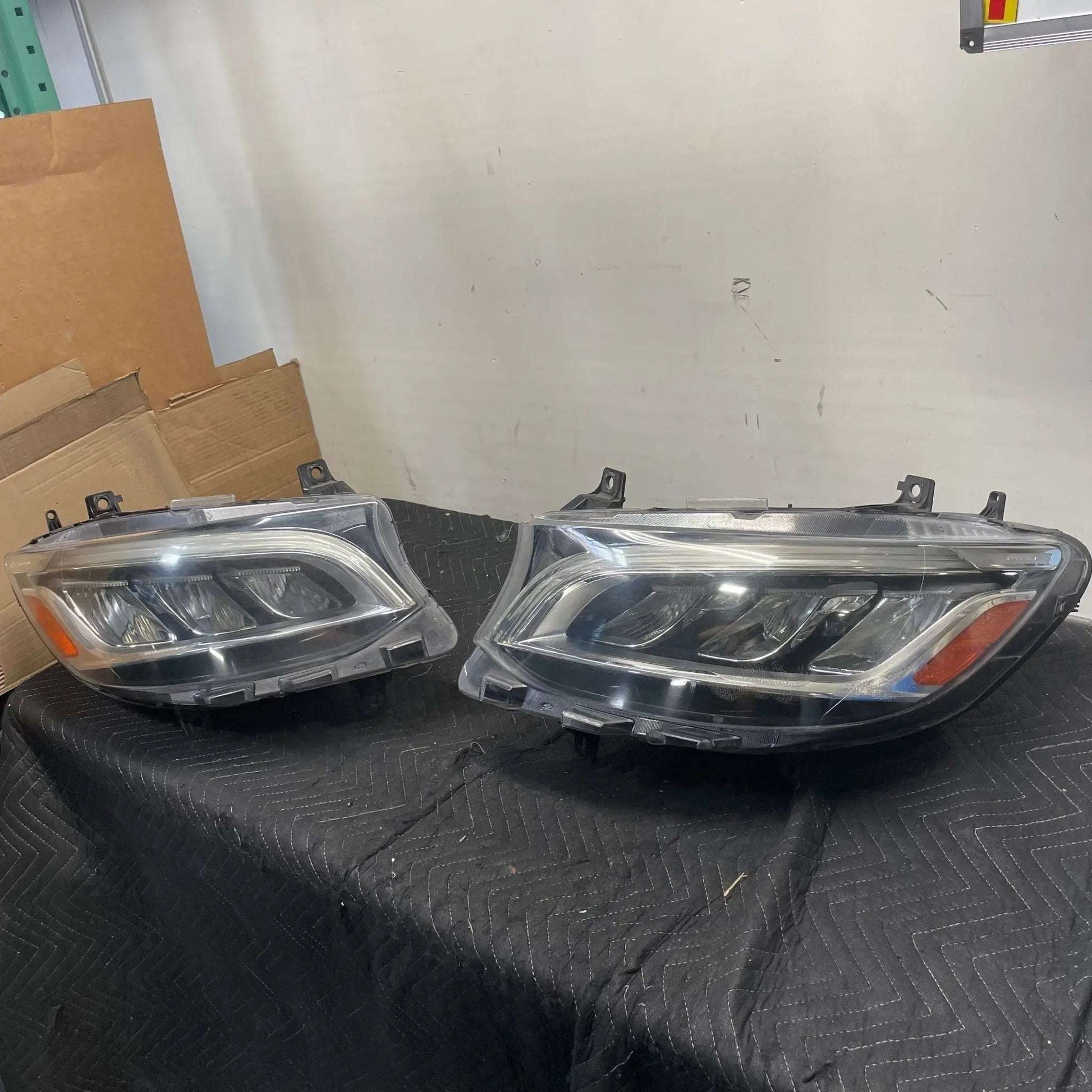 VS30 Factory Mercedes Sprinter LED Headlight Set on display, open box condition.