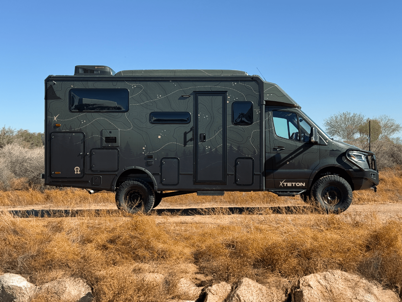 Teton Ekko Carrier System on Winnebago Ekko camping vehicle in outdoor setting.