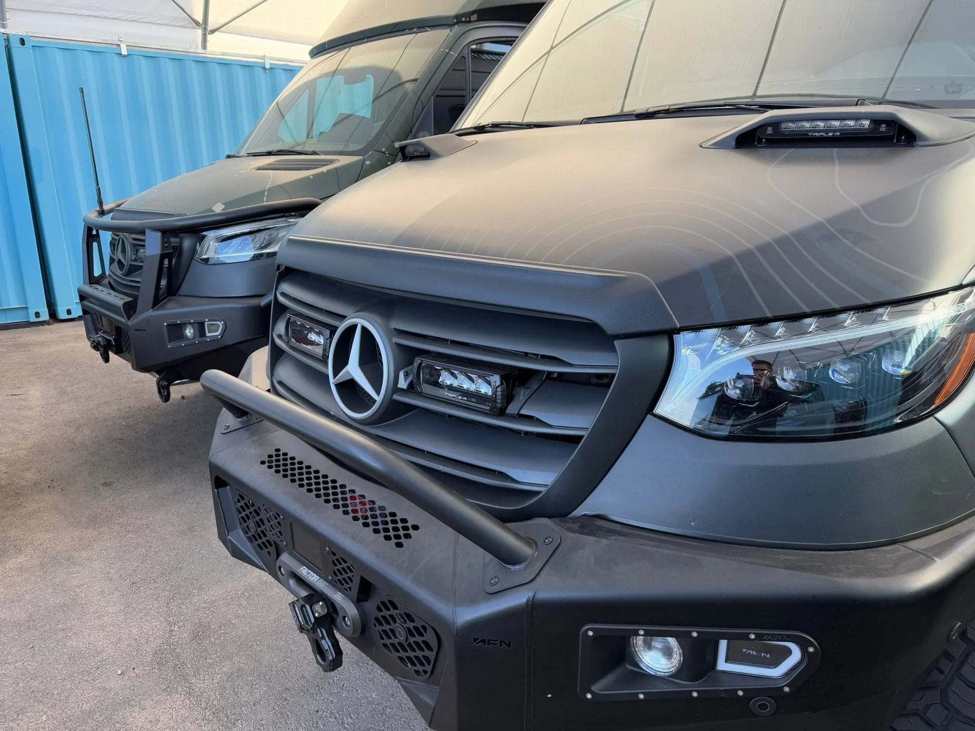 Aero Sprinter Hood Spoiler installed on 2019+ Sprinter enhancing airflow and protecting windshield.