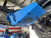 Blue powder-coated steel Sprinter 3500 skid plate protecting rear differential under van with visible driveshaft and tire in garage setting