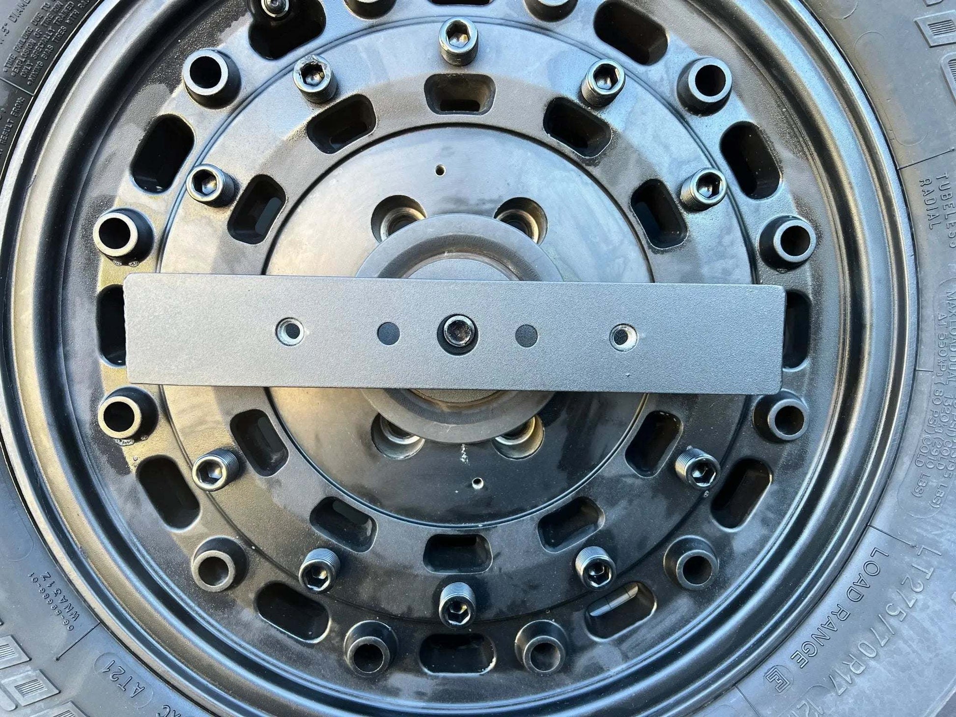 Expedition Handle 2.0 mounted on a vehicle tire carrier for enhanced functionality and security.