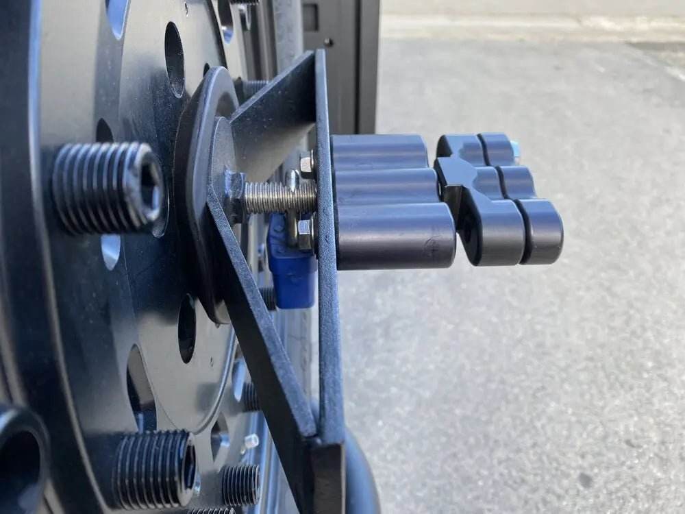 Expedition Handle 2.0 attached to tire carrier, showcasing CNC machined aluminum design with black anodized finish.