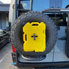 Expedition Handle 2.0 installed on vehicle tire carrier with attached Rotopax and rugged design.