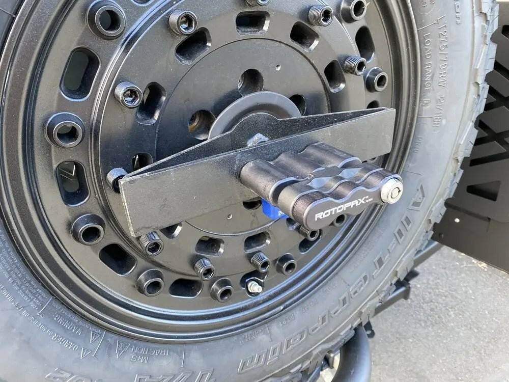 Expedition Handle 2.0 mounted on tire carrier with ergonomic design and black anodized finish.