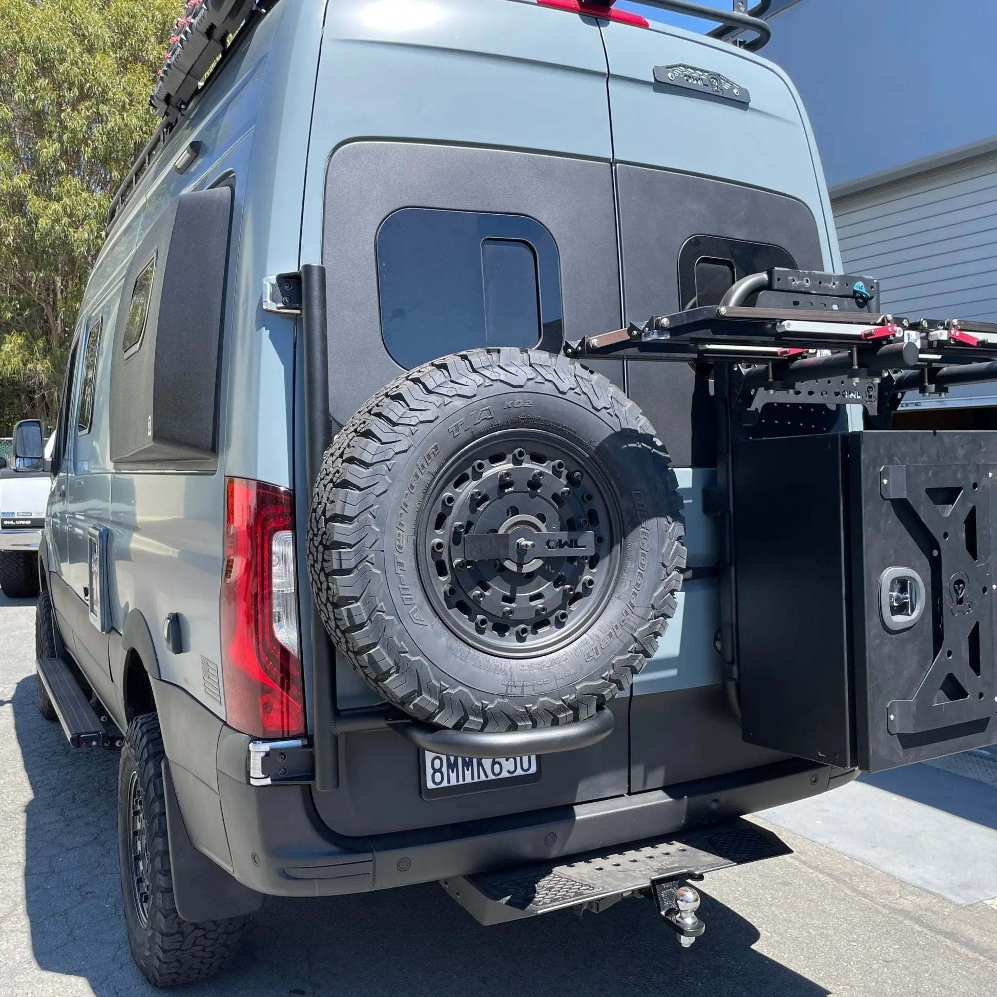 Expedition Tire Carrier mounted on a 2019+ Sprinter rear door.
