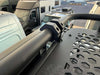 Close-up of Fiamma roof rack with 1.5" round bar mounts on Sprinter awning mount