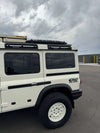 Magnetic Maxtrax Mounts on INEOS Grenadier roof for adventure and utility.